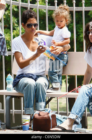 Actress Halle Berry dresses her daughter Nahla in an identical outfit to her own for a day of fun at the park. The X-Men star Stock Photo