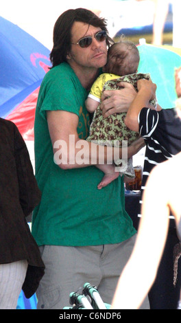 Jim Carrey holding his grandson Jackson Santan on Malibu Beach Malibu, California - 04.07.10 Stock Photo