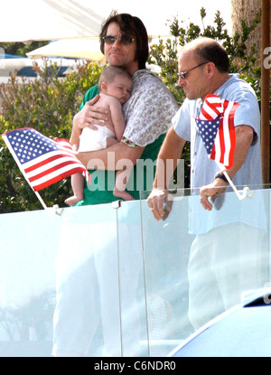 Jim Carrey holding his grandson Jackson Santana on Malibu Beach Malibu, California - 04.07.10 Stock Photo