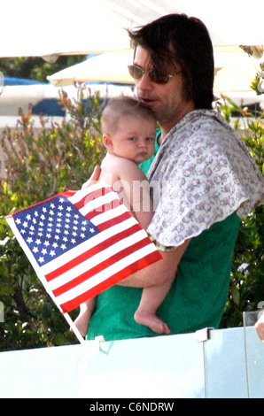 Jim Carrey holding his grandson Jackson Santana on Malibu Beach Malibu, California - 04.07.10 Stock Photo