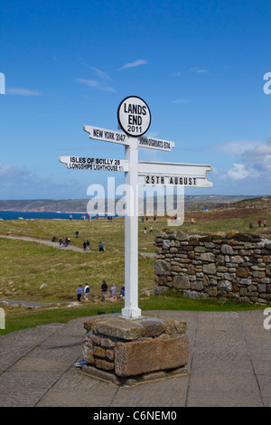 Famous signpost at Lands End Cornwall showing distances to various landmarks Stock Photo