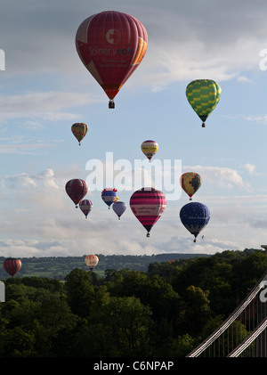 dh Bristol Balloon Fiesta CLIFTON BRISTOL Balloon festival hot air balloons flying in sky above Clifton Suspension bridge uk Stock Photo