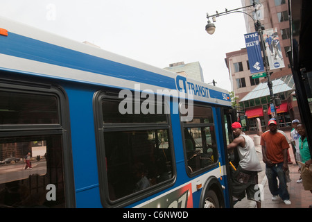 Commuters board a CT Transit bus in Hartford, Connecticut, Saturday August 6, 2011. Stock Photo