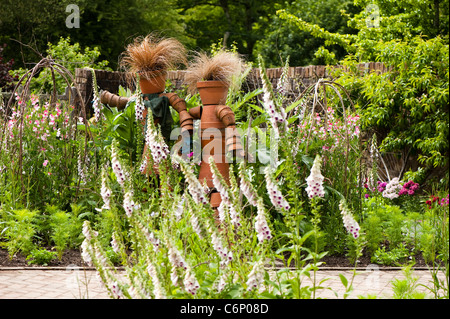 Flower pot scarecrows in the Fruit and Vegetable Garden at RHS Rosemoor, Devon, England, United Kingdom Stock Photo