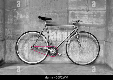 Vintage fixed-gear bicycle with a pink chain Stock Photo