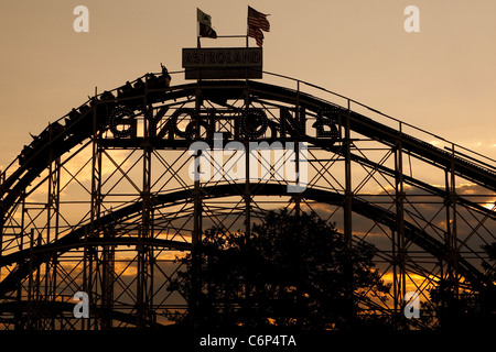 The sun set on the Coney Island Cyclone roller coaster on Coney Island in New York city borough of Brooklyn Stock Photo