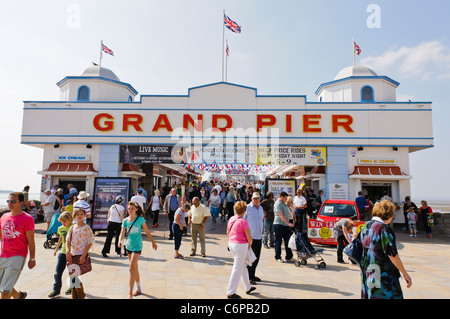 People walk along the Grand Pier at Weston-Super-Mare Stock Photo