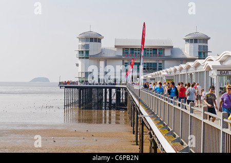 People walk along the Grand Pier at Weston-Super-Mare Stock Photo