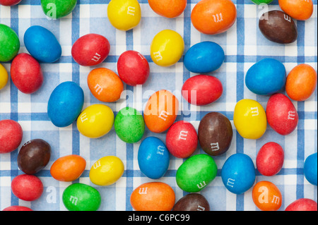 M & M s on colourful square patterned background Stock Photo