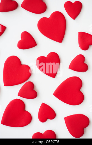 Red coloured love hearts on white background Stock Photo
