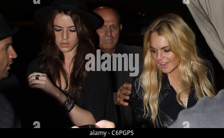 Lindsay Lohan leaving Teddy's nightclub in Hollywood, wearing a striped dress and leather jacket. Los Angeles, California, USA Stock Photo