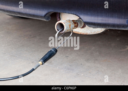 exhaust emissions test during an MOT check for a car in UK Stock Photo