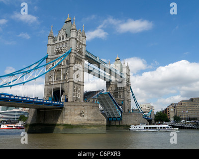 Tower Bridge, road section raised for boats, Historic tourist attraction, river Thames London England UK. Stock Photo