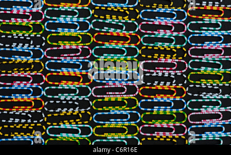 Multicoloured paper clips pattern on black background Stock Photo