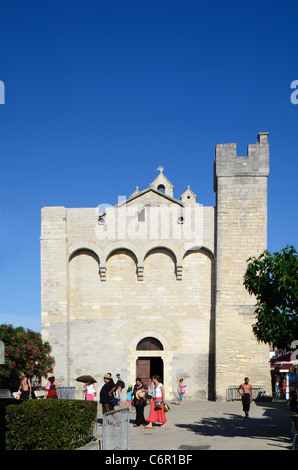 Tourists Outside the Fortified Church of Les Saintes-Maries-de-la-Mer or Les Saintes Maries de la Mer Camargue Provence France Stock Photo