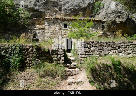 Troglodyte House built into the Cliff in the Abandoned or Deserted Village of Barry Drôme Provence France Stock Photo