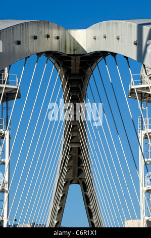 Suspension bridge (known as the Lowry Bridge) over the Manchester Ship Canal in Salford Quays near Manchester, England, UK Stock Photo
