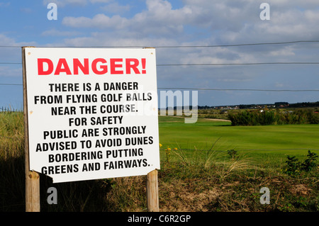 Danger From Flying Golf Balls warning Sign, Royal West Norfolk Golf Club, Brancaster, Norfolk, England, UK, Stock Photo