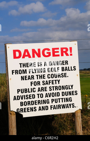 Danger From Flying Golf Balls Notice, Royal West Norfolk Golf Club, Brancaster, Norfolk, England, UK Stock Photo