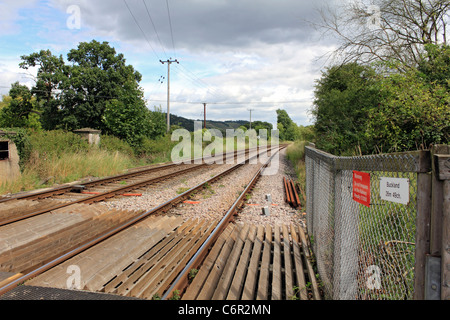 Railway track at the level crossing at Buckland near Reigate, Surrey England UK Stock Photo