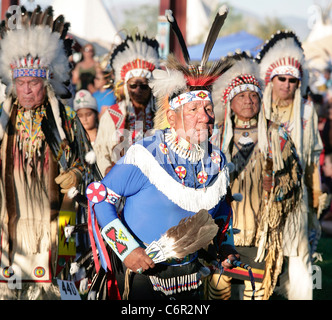 Dancers leading the Grand Entry part of a powwow held during the annual Shoshone-Bannock Festival in Ft. Hall, Idaho. Stock Photo