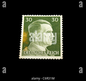 A Postage stamp isolated in black Stock Photo