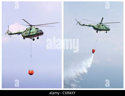 Helicopter extinguish fire with water tank Stock Photo