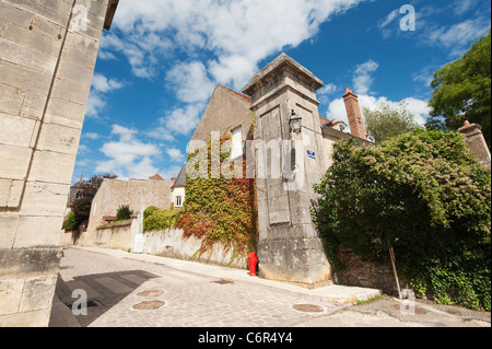 Rue Bocquillot and stone entrance gateway in Avallon, Burgundy, France. Stock Photo