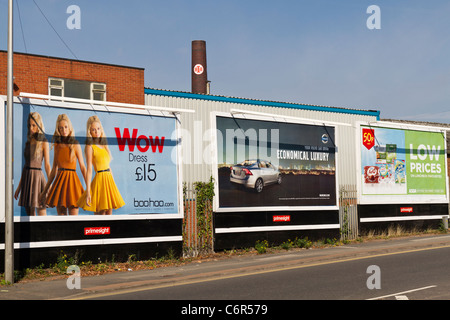 Roadside advertising hoardings or billboards UK Stock Photo