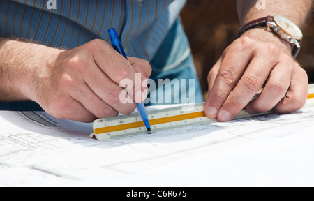 Working on construction plans Stock Photo