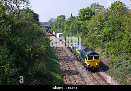 Freightliner 66540 heads a Leeds - Sotuhampton liner through Streetly on the freight only Sutton Park line on 20/04/11. Stock Photo