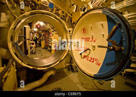 An open watertight door of the Soviet diesel-electric attack submarine B-39 gives access to the vessel's control room. Stock Photo