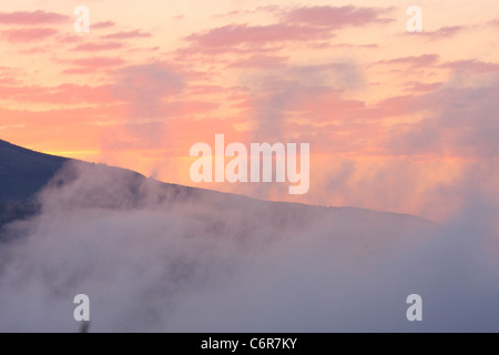 Early morning mist over a valley Stock Photo