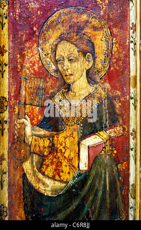 North Elmham, Norfolk, Rood screen, St. Petronella, holding Key to Gates of Heaven female saint saints English screens church Stock Photo