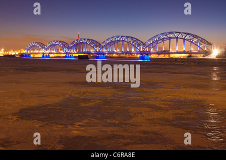 Railway bridge at night in winter Stock Photo