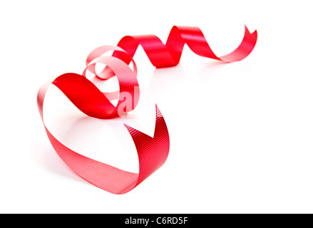 Curled red holiday ribbon strip isolated on white background Stock Photo