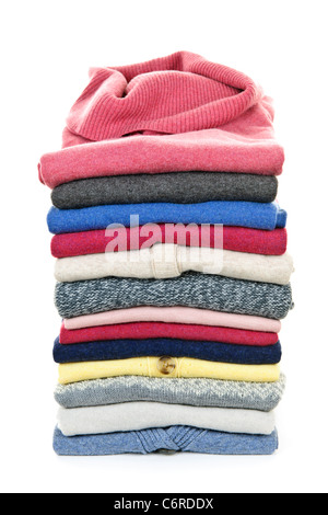 Stack of warm sweaters isolated on white background Stock Photo