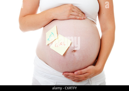 Pregnant belly with sticky notes over white background Stock Photo
