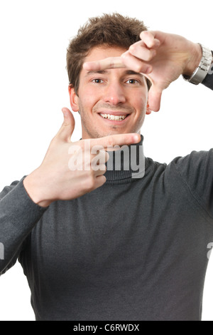 Modern casual guy looking with a smile through finger frame isolated on white Stock Photo
