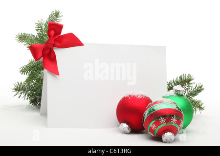 Christmas Ornaments with blank card on white background. Stock Photo