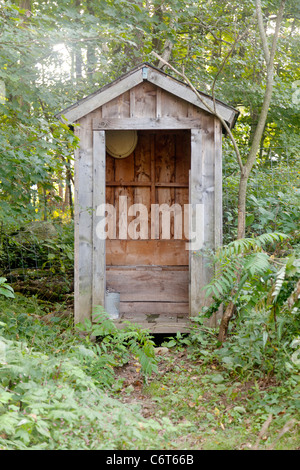 Outhouse in the woods, upstate New York Stock Photo