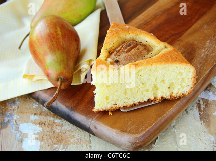 homemade cake with pears on a wooden table Stock Photo