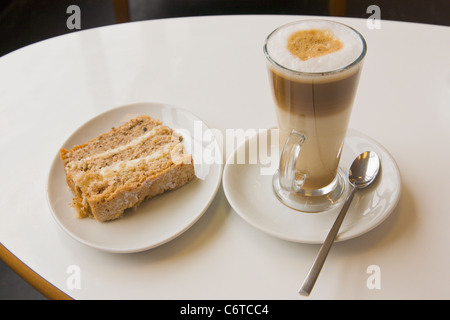 Latte coffee, walnut cake Stock Photo