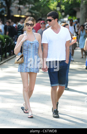 Whitney Port in flip flops and a short blue and white dress, out and about on a hot day with and Ben Nemtin in Manhattan New Stock Photo