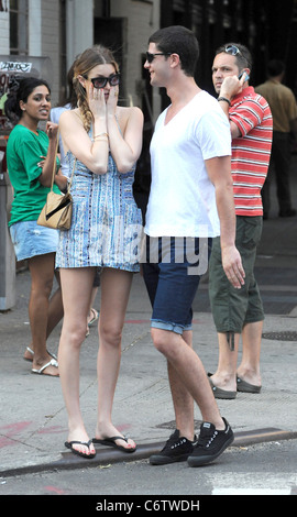 Whitney Port in flip flops and a short blue and white dress, out and about on a hot day with and Ben Nemtin in Manhattan New Stock Photo