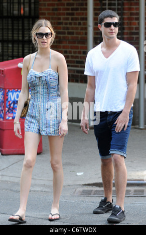 Whitney Port in flip flops and a short blue and white dress, out and about on a hot day with and Ben Nemtin in Manhattan New Stock Photo