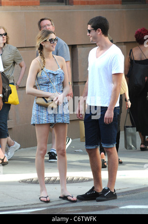 Whitney Port in flip flops and a short blue and white dress, out and about on a hot day with and Ben Nemtin in Manhattan New Stock Photo