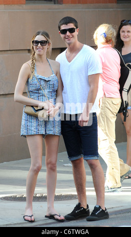 Whitney Port in flip flops and a short blue and white dress, out and about on a hot day with and Ben Nemtin in Manhattan New Stock Photo