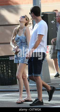 Whitney Port in flip flops and a short blue and white dress, out and about on a hot day with and Ben Nemtin in Manhattan New Stock Photo