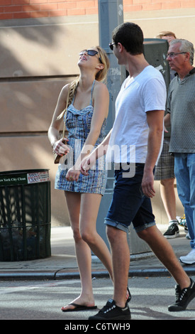 Whitney Port in flip flops and a short blue and white dress, out and about on a hot day with and Ben Nemtin in Manhattan New Stock Photo